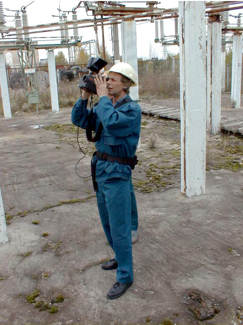 Technician with infrared thermography unit