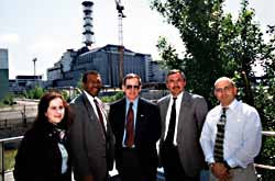 Dr. Jim Turner and other U.S. team members pause in front of the Chornobyl Shelter while touring the Chornobyl site.