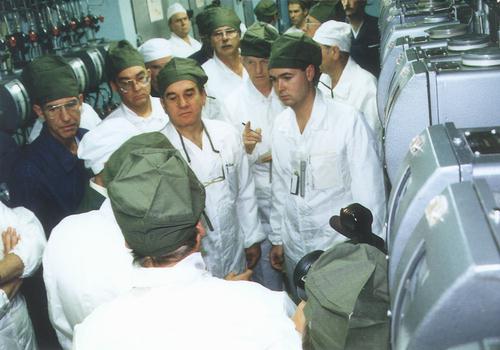 U.S./Russian core conversion team members review conditions at
the ADE-2 plutonium production reactor at Zheleznogorsk.